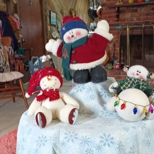 Two Cute Snowmen.  Ice skate one has sold.